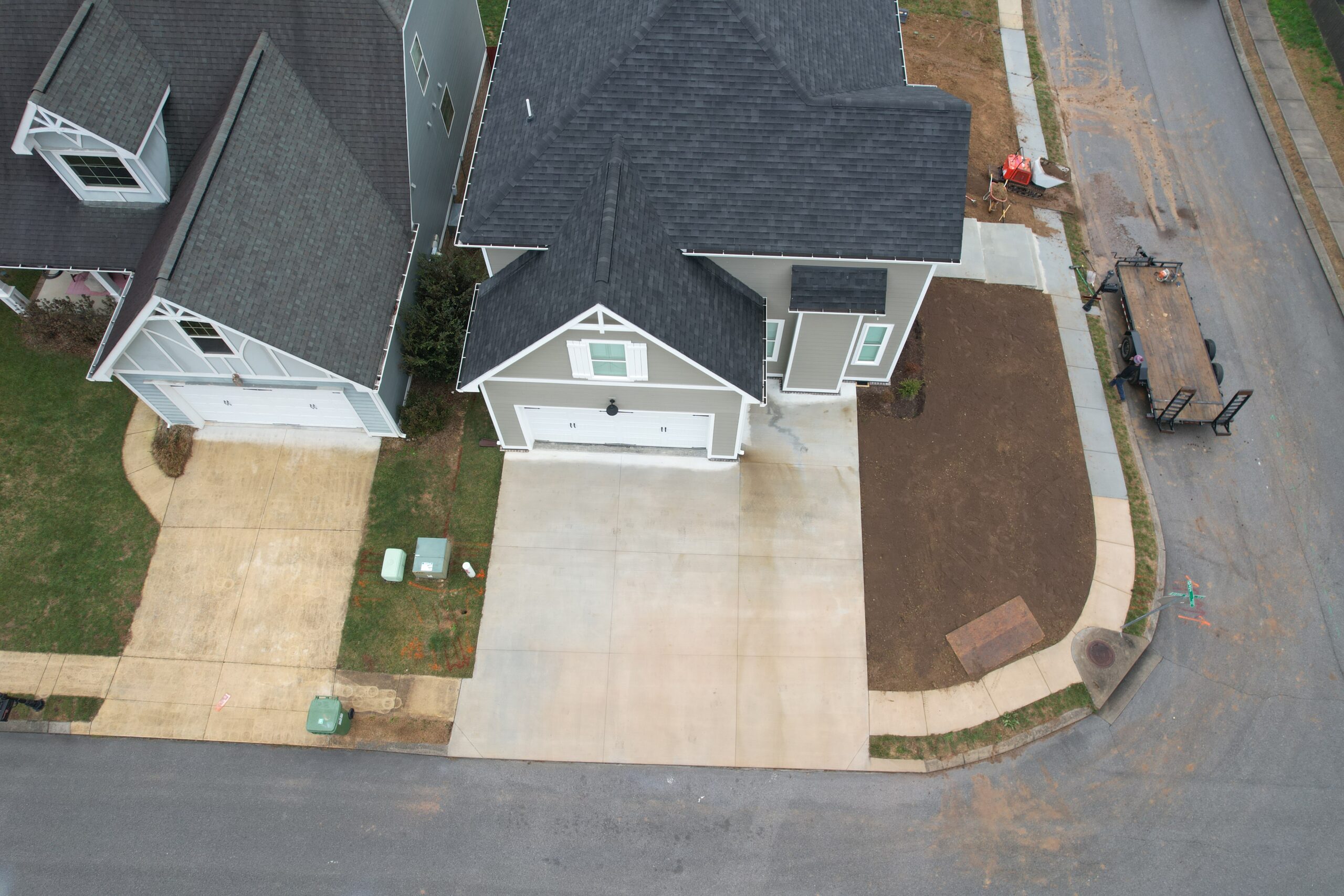 Ray Lawns crew grading and leveling topsoil before sod installation in Ooltewah TN