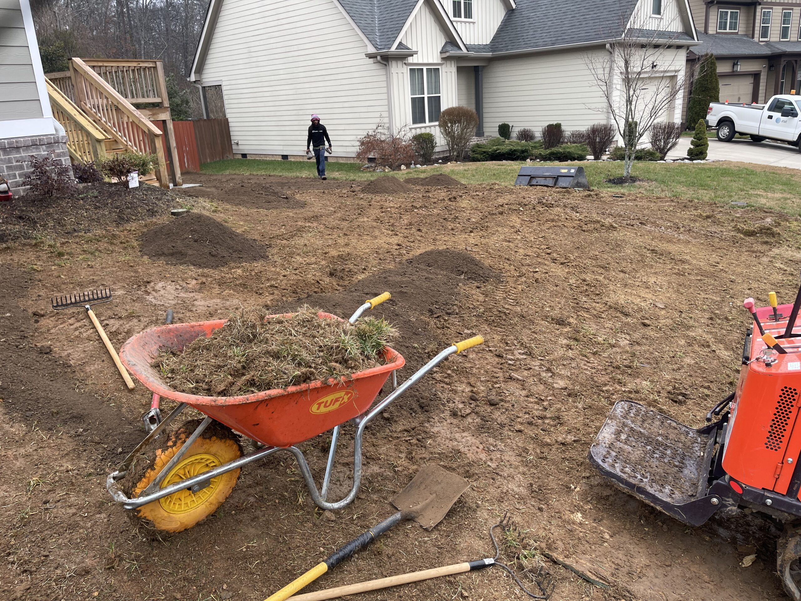 Ray Lawns crew tilling and removing debris during sod installation prep in Ooltewah TN