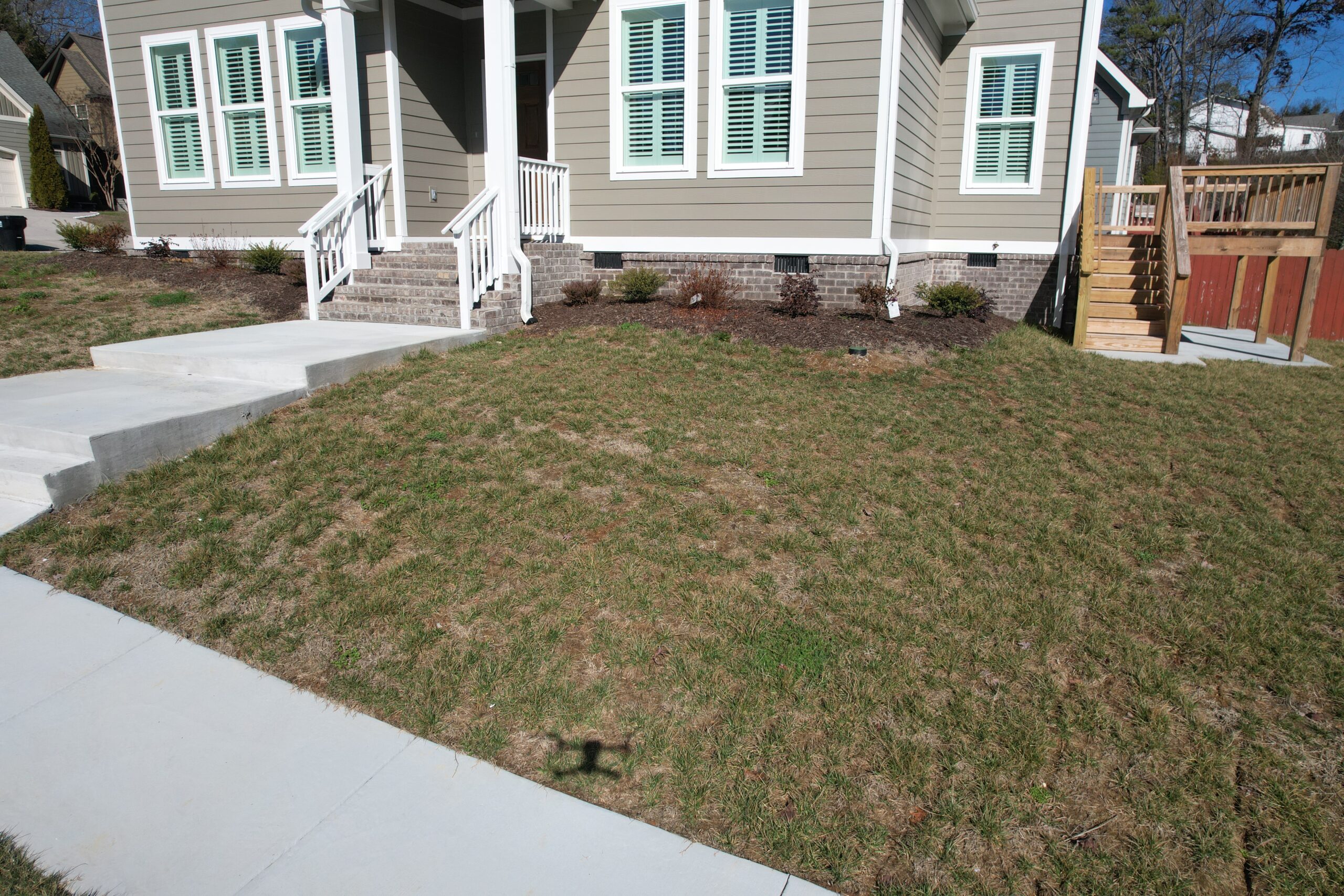 Ray Lawns crew assessing patchy yard before sod installation in Chattanooga TN