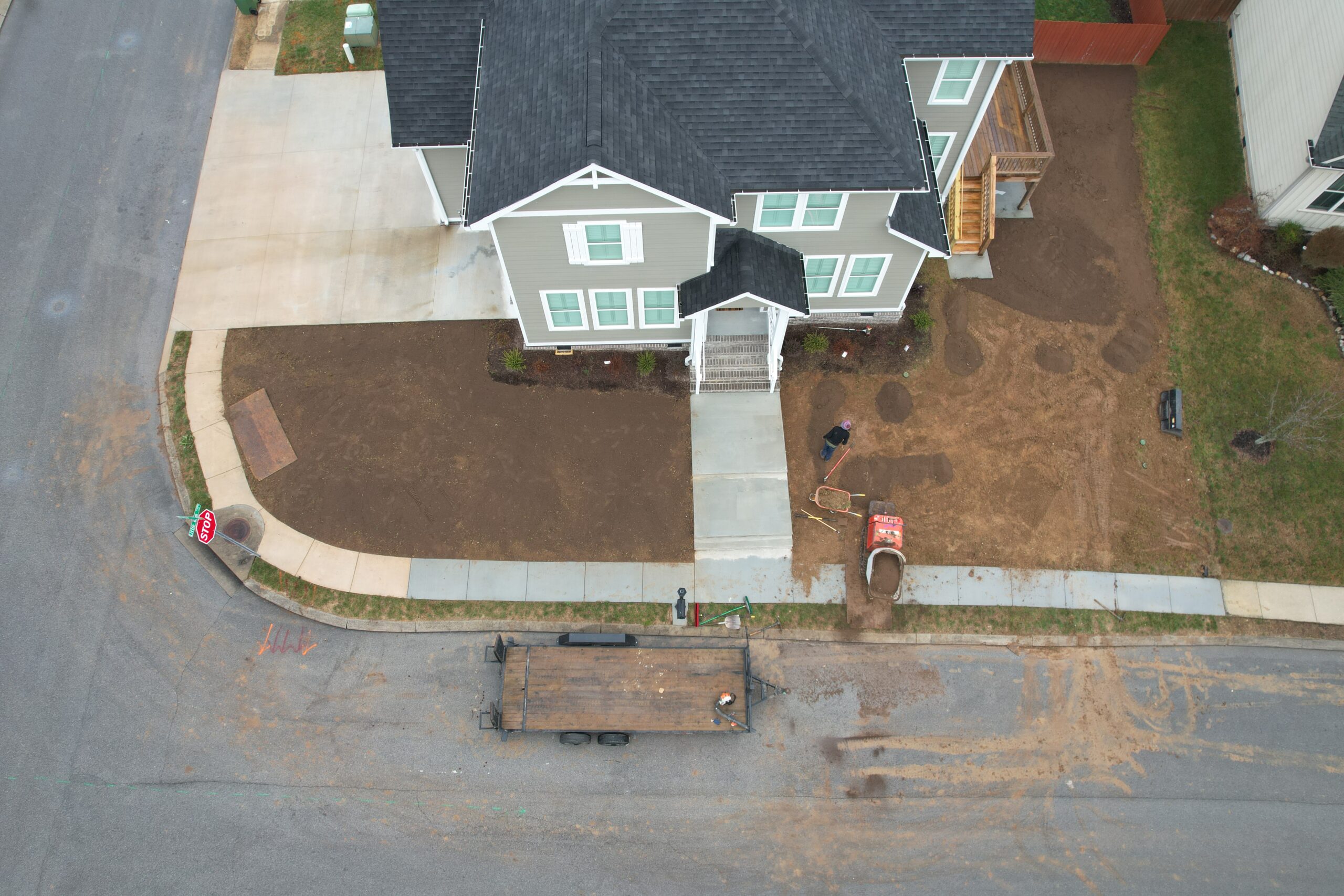 Ray Lawns spreading local sifted topsoil during sod installation in Chattanooga TN